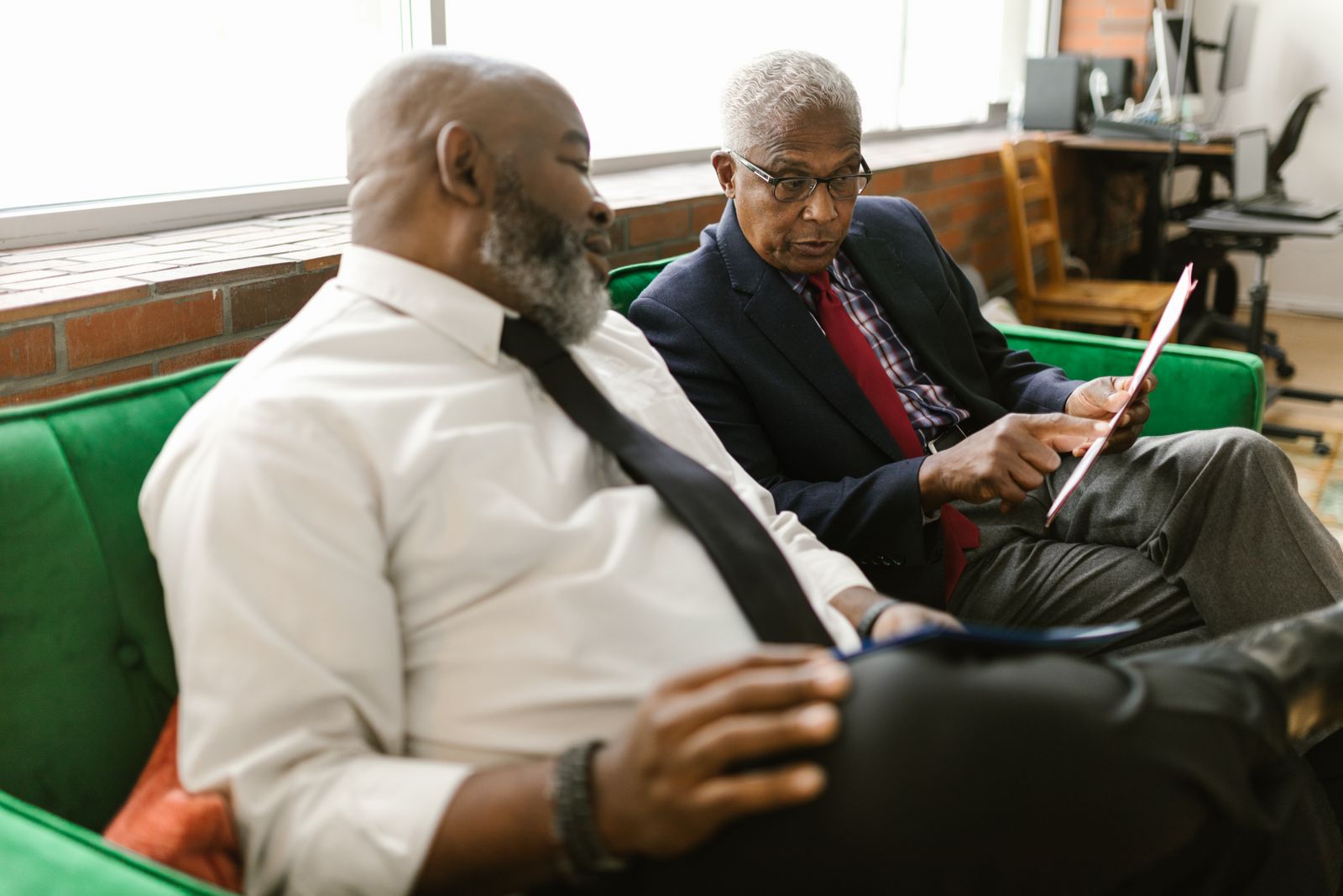 Three colleagues looking at a tablet together